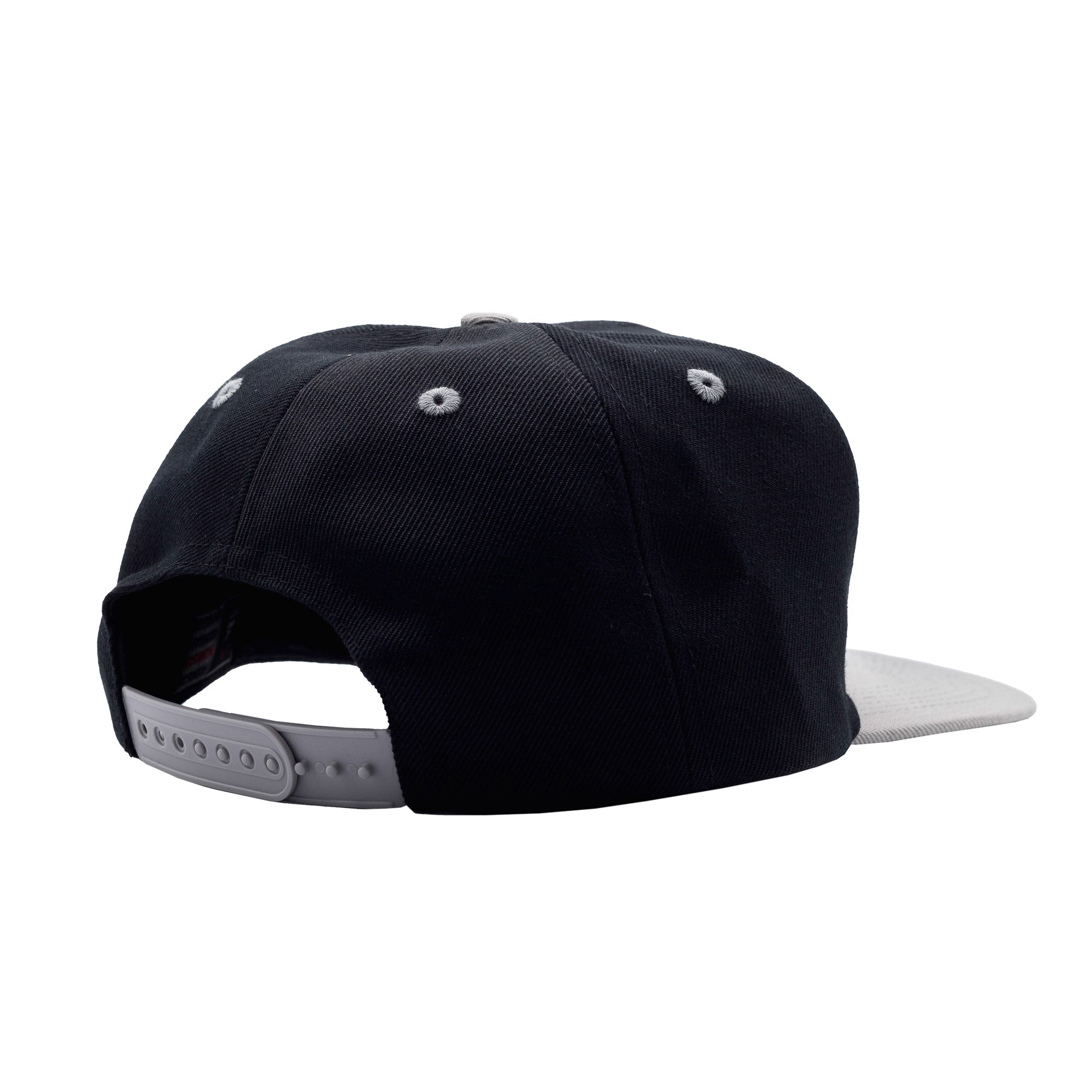 Black and gray Hoonigan BRACKET X LOGO snapback hat with adjustable strap, featuring a flat brim and embroidered eyelets.