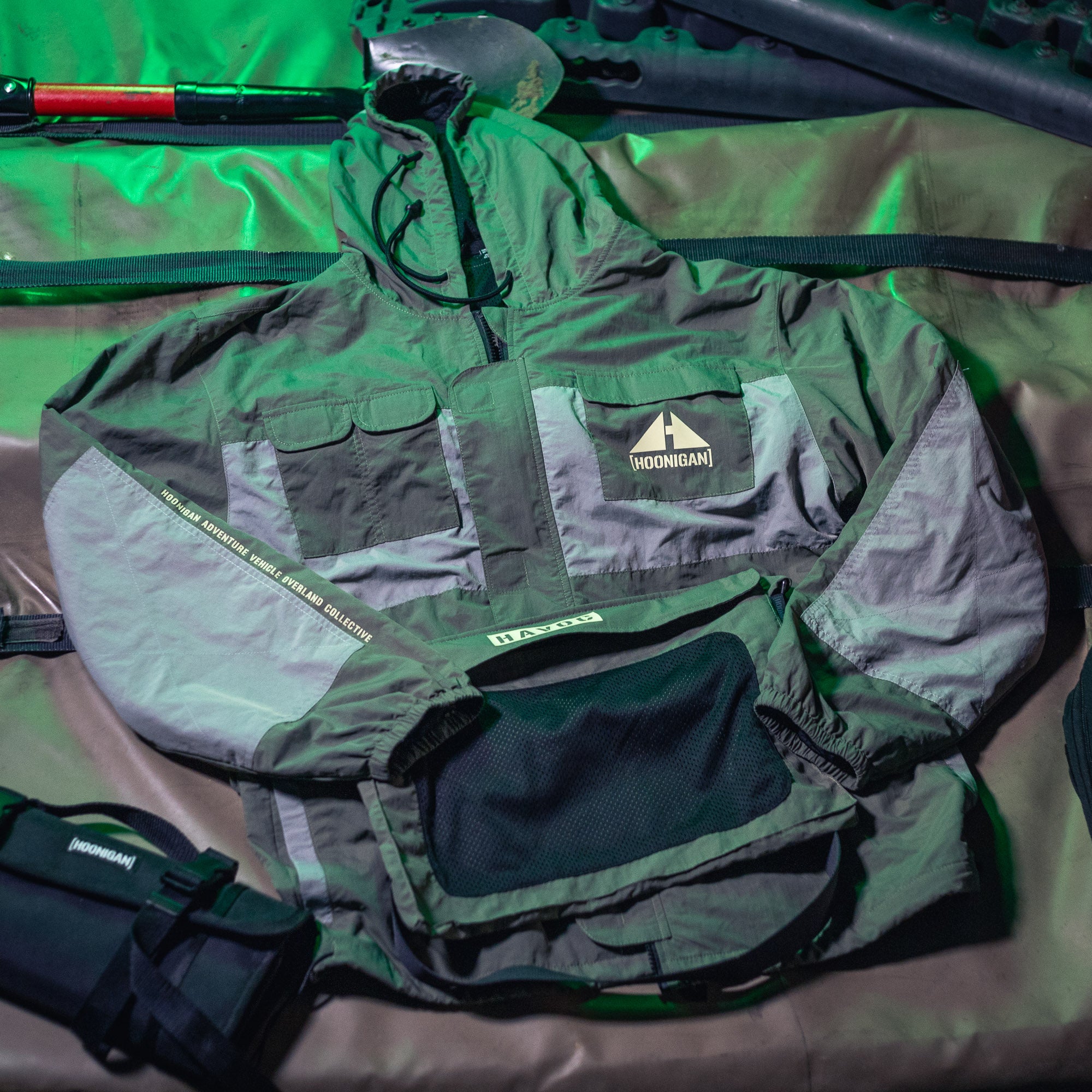 Hoonigan H.A.V.O.C. rain-activated windbreaker jacket with multiple pockets, adjustable hood, and reflective accents.