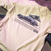 Beige Hoonigan SAFARI short sleeve tee featuring a graphic of an overland vehicle with a tent, and text about Hoonigan adventure vehicles.