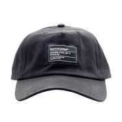 Unstructured black strapback hat with a gray brim and a patch that reads "ROTIFORM MAKING COOL S#*% SINCE 09" on the front.