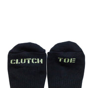 Hoonigan glow-in-the-dark socks featuring "CLUTCH" and "TOE" text on the toes for automotive enthusiasts.