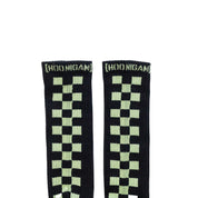 Hoonigan glow-in-the-dark socks featuring a checkered pattern in green on a black background, ideal for car enthusiasts.