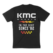 Black short sleeve t-shirt featuring KMC Wheels logo and "In the Dirt Since '82" graphic on the back. Ideal for motorsport enthusiasts.