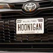 Hoonigan METAL License Plate featuring a sleek design with bold graphics and the Hoonigan logo.