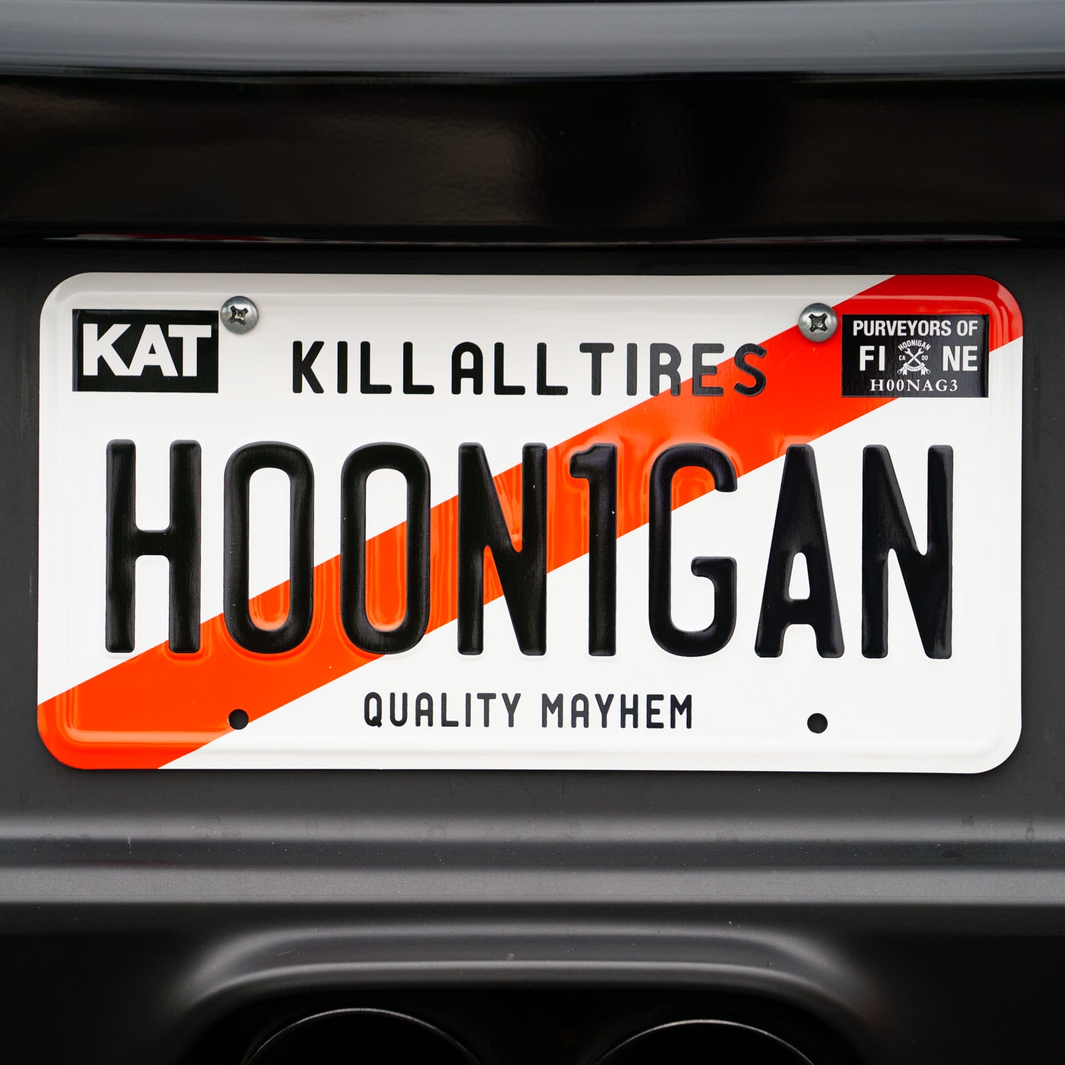 Hoonigan KARI license plate featuring a bold graphic design with a black background and white lettering.