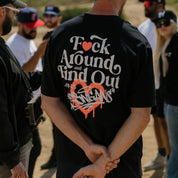 Hoonigan FIND OUT Short Sleeve Tee, featuring a bold graphic design on a black background.