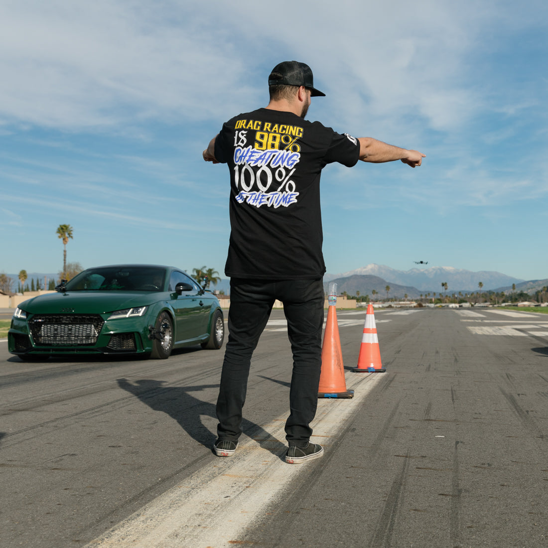 Hoonigan THIS VS THAT Short Sleeve Tee featuring bold graphics and a black colorway, displayed on a wooden surface.