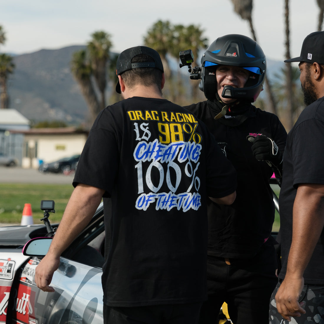 Black short sleeve tee featuring Hoonigan's "THIS VS THAT" graphic on the front, showcasing a bold, racing-inspired design.
