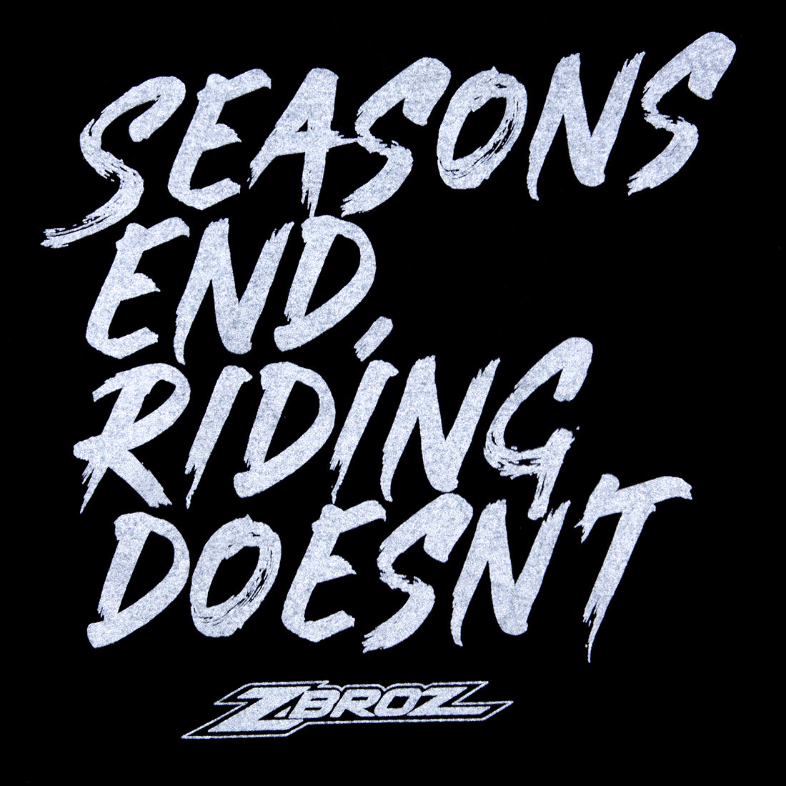 Black short sleeve ZBROZ SEASONS NEVER END tee featuring a bold "Riding Doesn't End" graphic on the back.