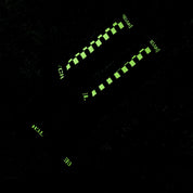 Hoonigan glow-in-the-dark socks featuring a bold design, perfect for automotive enthusiasts and night adventures.
