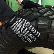 Hoonigan Scatter Censor Bar Logo gloves gripping a large tire, showcasing a bold black and white design.