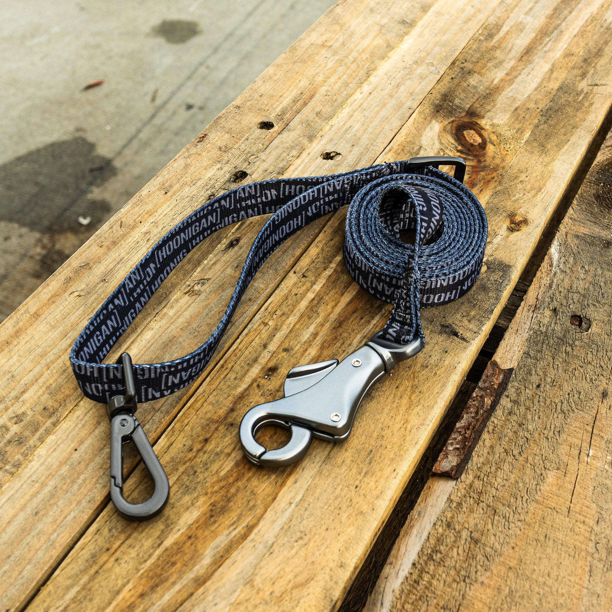 Hoonigan Scatter Censor Bar logo dog leash featuring durable fabric and a sturdy metal clip for secure attachment.