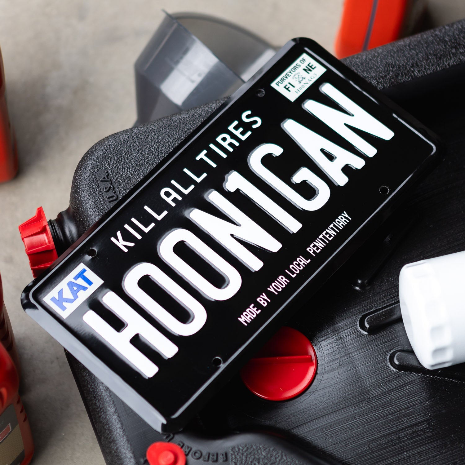 Hoonigan H00N1GAN license plate featuring bold lettering and a playful slogan, perfect for automotive enthusiasts.