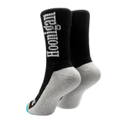 Black and gray Hoonigan BURNOUT TEAM socks featuring a bold logo, designed for motorsport enthusiasts and car culture fans.