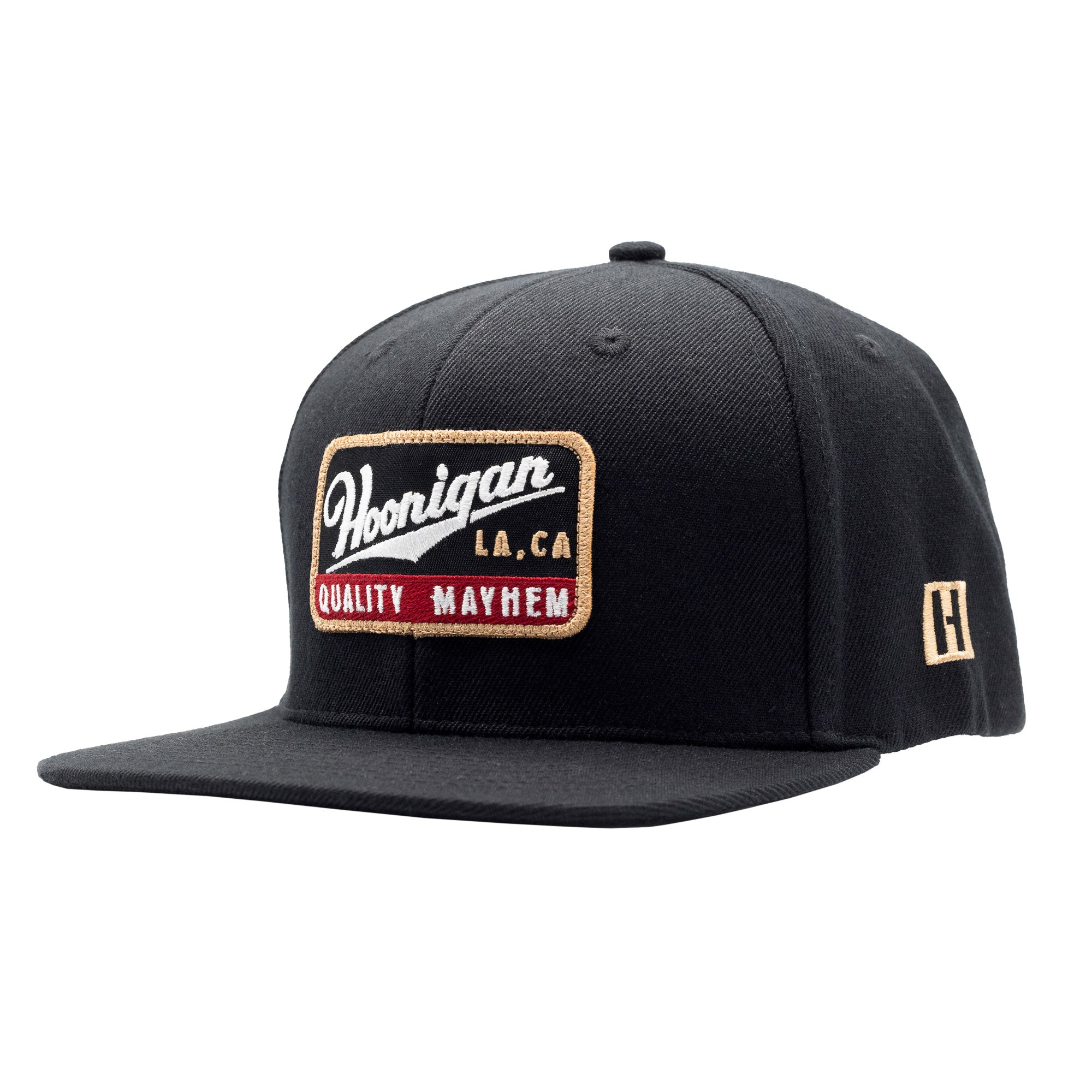 Black snapback hat featuring a Hoonigan logo patch with "Quality Mayhem" text, perfect for motorsport enthusiasts.