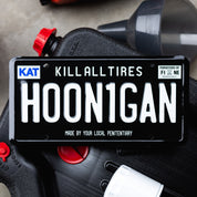 Hoonigan H00N1GAN license plate featuring bold white lettering on a black background, designed for automotive enthusiasts.