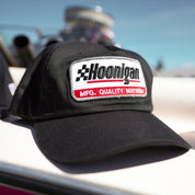 Black Hoonigan RACEDAY unstructured strapback hat featuring embroidered logo and text on the front.
