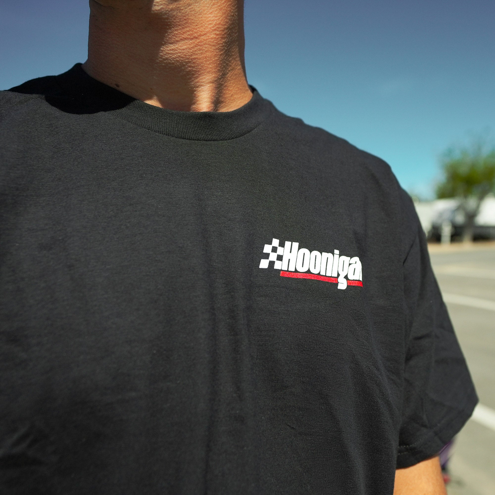 Black Hoonigan RACE DAY short sleeve t-shirt featuring a bold logo, perfect for motorsport enthusiasts and car culture fans.