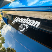 Hoonigan BOOST LEAK sticker featuring a turbocharger graphic, applied on a glossy black surface.