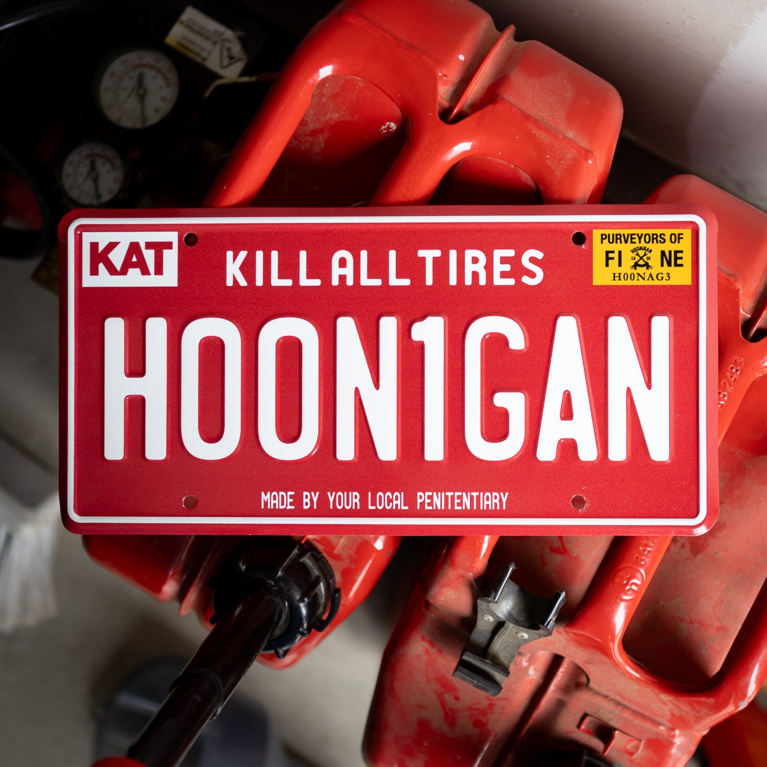 Red Hoonigan OG Arizona license plate featuring the phrase "Kill All Tires" and a playful twist on the brand name.