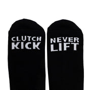 Black socks featuring bold white text that reads "CLUTCH KICK" on one side and "NEVER LIFT" on the other, perfect for motorsport fans.