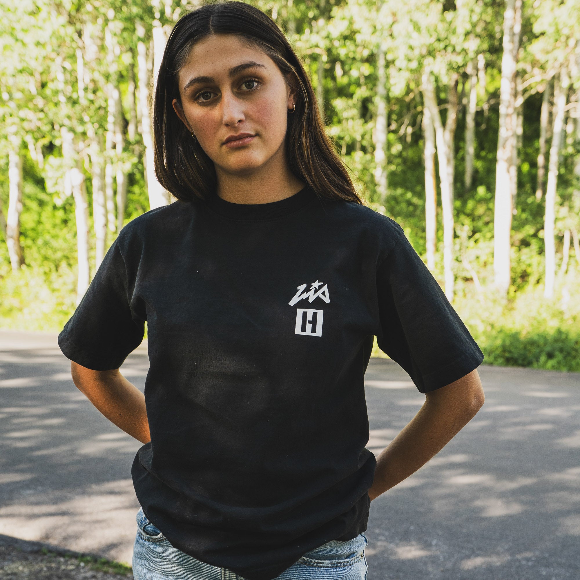 Model wearing Hoonigan x Lia Block UR STAR Short Sleeve T-Shirt in black, showcasing a stylish automotive lifestyle design.