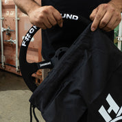 Limited edition Hoonigan steering wheel being held, showcasing unique design and branding for motorsport enthusiasts.