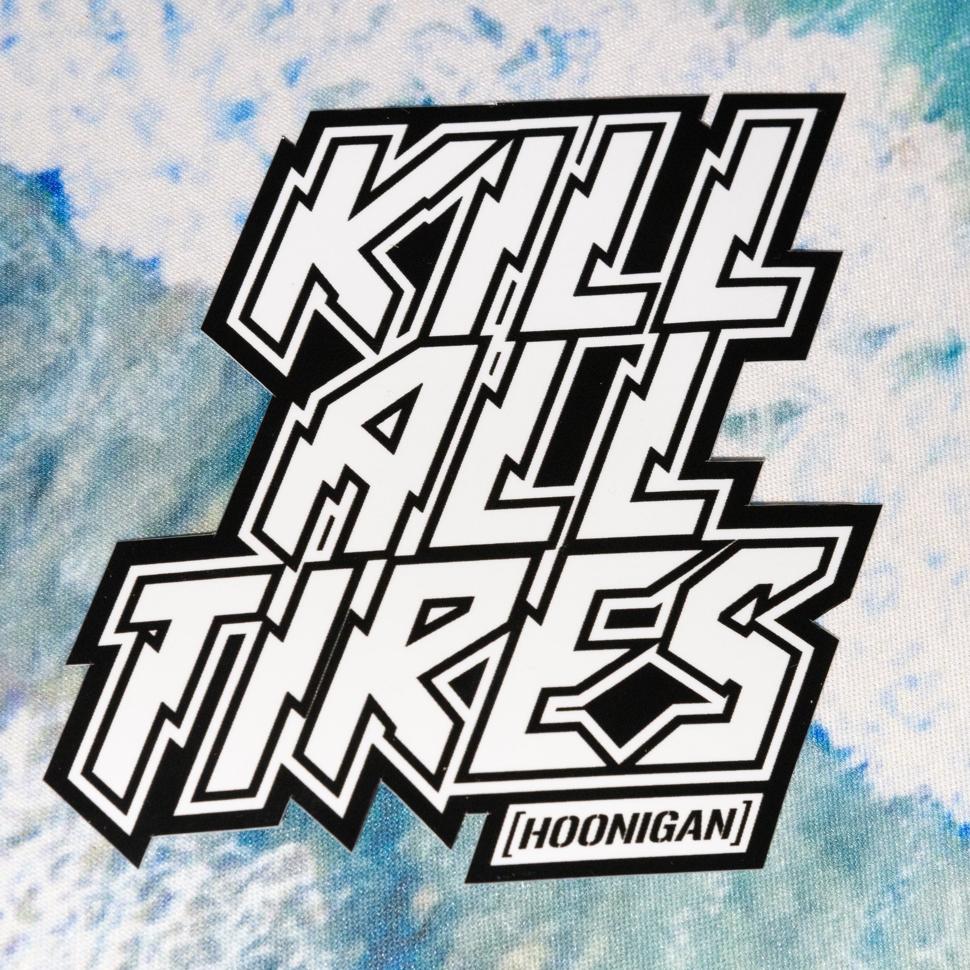 Hoonigan KILL ALL TIRES sticker featuring bold black and white lettering on a textured background.
