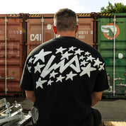 Black short sleeve t-shirt featuring a star graphic on the back, designed in collaboration with Lia Block for Hoonigan.