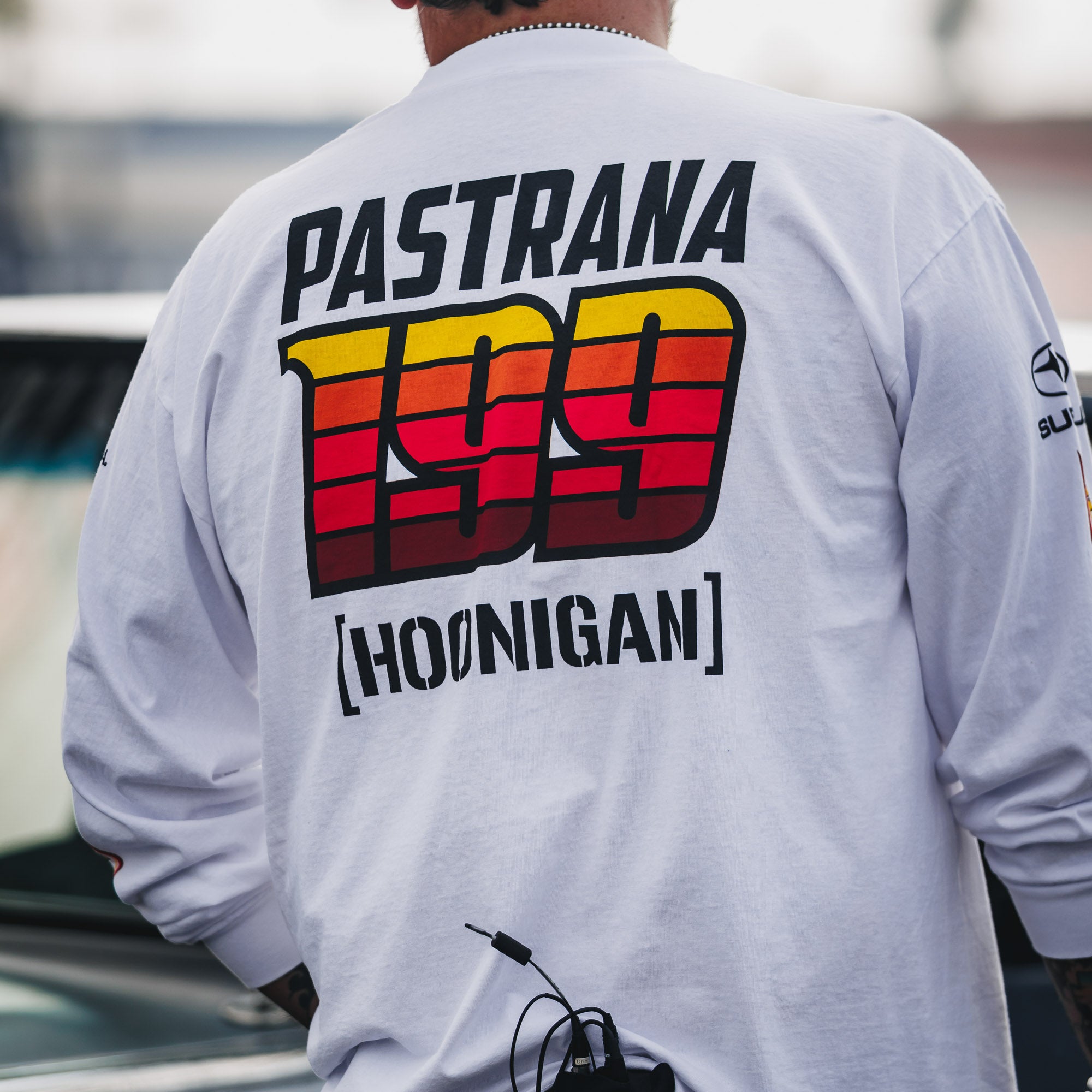 Hoonigan GYMKHANA AUSSIE SHRED Team Long Sleeve T-Shirt featuring bold graphics and Travis Pastrana's number 199 on the back.