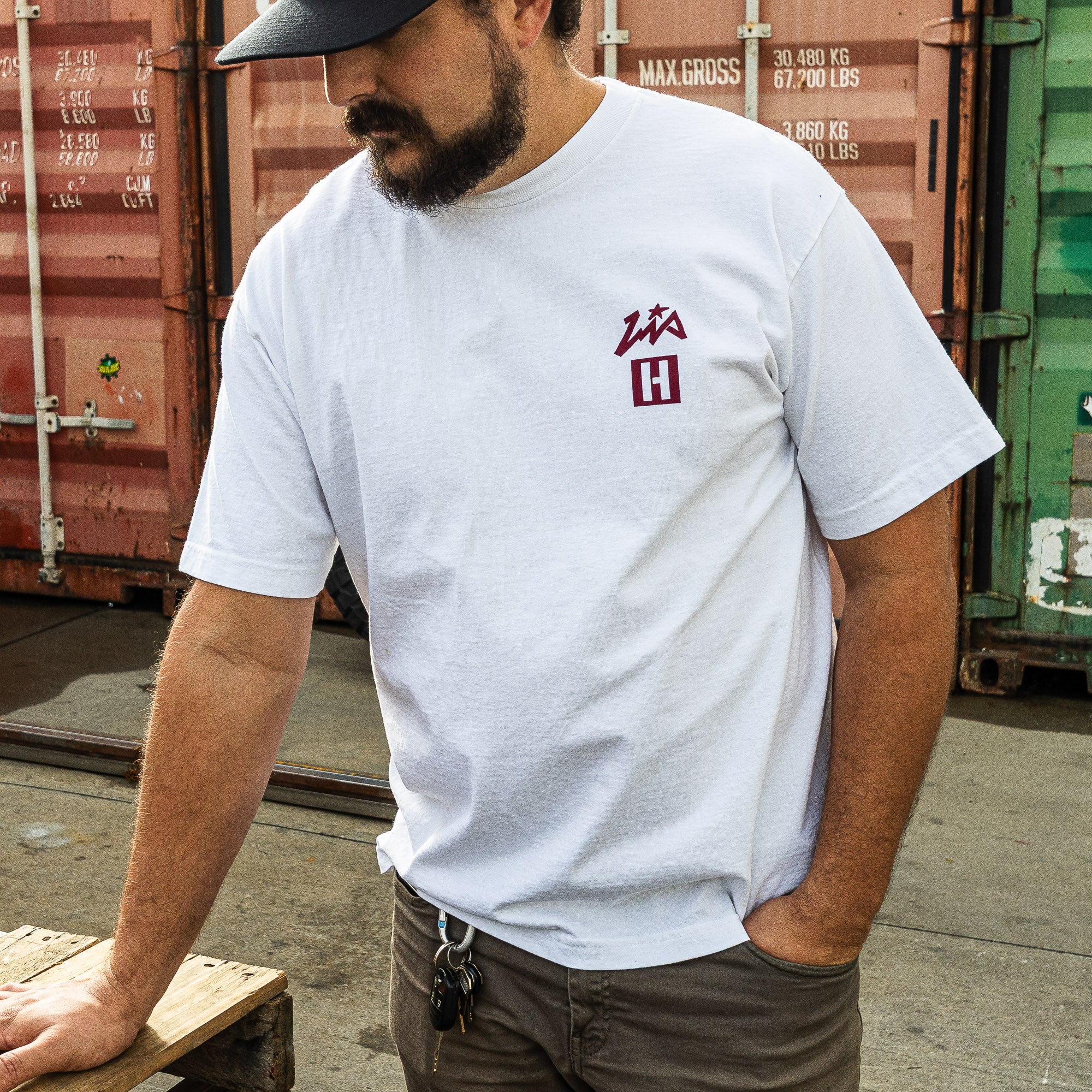 White short sleeve t-shirt featuring Hoonigan and Lia Block logos, perfect for motorsport enthusiasts and casual wear.