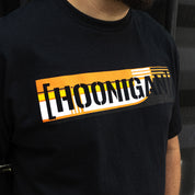 Black short sleeve t-shirt featuring bold Hoonigan SCUMBUG CENSOR BAR graphic in orange and white. Ideal for motorsport enthusiasts.