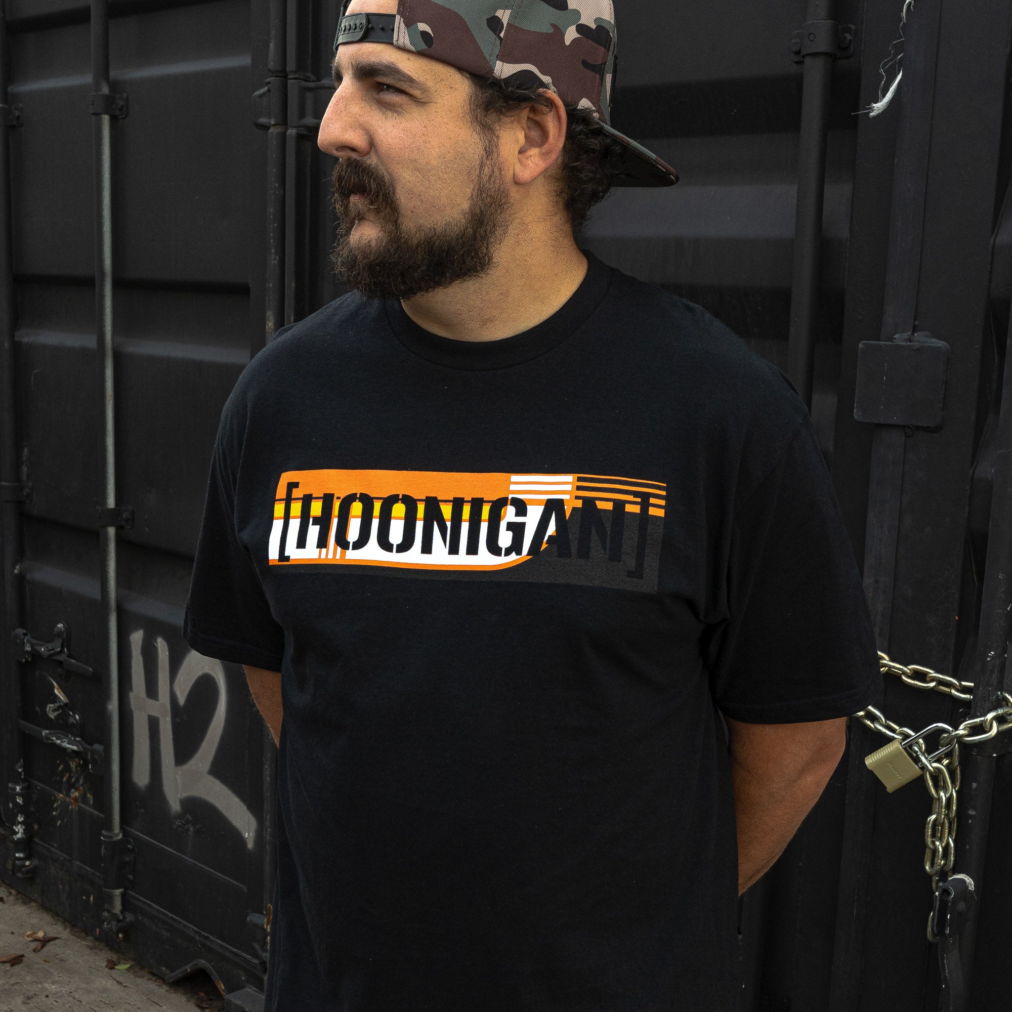 Black short sleeve t-shirt featuring bold Hoonigan logo with a striking design, perfect for motorsport enthusiasts.