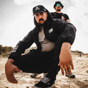 Hoonigan Motorsports windbreaker jacket in black with colorful logo and graphics.