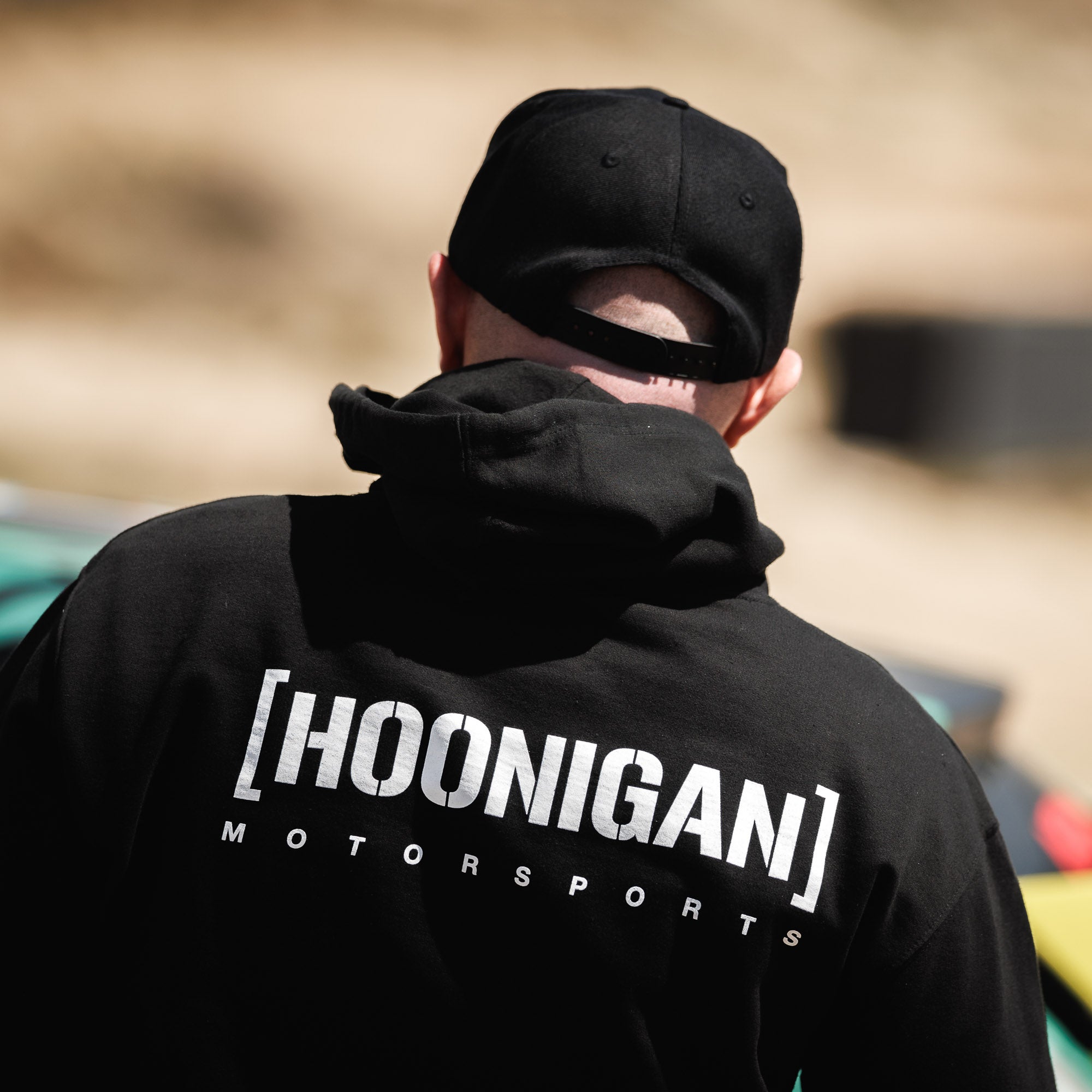 Hoonigan Motorsports pullover hoodie in black, featuring a bold logo on the front, adjustable drawstring hood, and a comfortable fit.