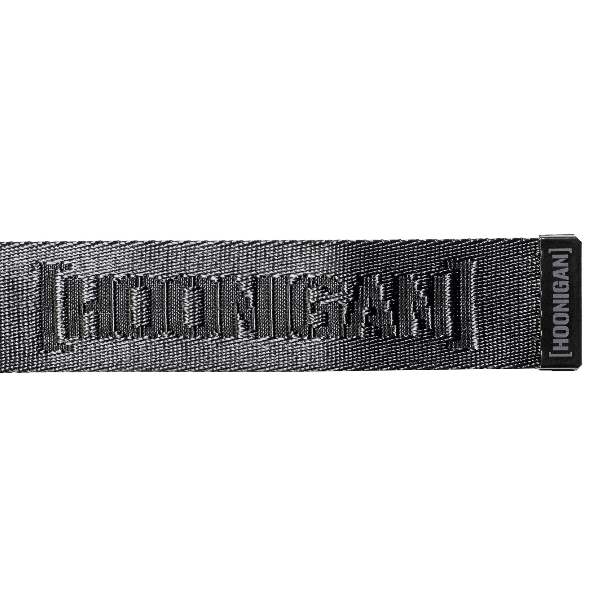 Hoonigan CAUTION TAPE Reversible Belt featuring a bold logo design, perfect for automotive lifestyle enthusiasts.