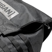 Close-up of the Hoonigan CENSOR BAR backpack featuring a zippered opening and durable fabric, ideal for automotive enthusiasts.