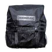 Hoonigan CENSOR BAR spare tire backpack features a sleek black design with adjustable straps and mesh pockets for storage.