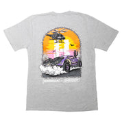 Gray short sleeve t-shirt featuring a vibrant graphic of a car kicking up dust under a helicopter, representing Hoonigan x Shreddy collaboration.