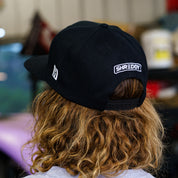 Black snapback hat featuring "SHREDDY" logo, designed for motorsport enthusiasts and aggressive driving fans.