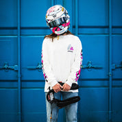 Hoonigan x Lia Block SCRIPT Long Sleeve T-Shirt worn by a person holding a racing harness, set against a blue background.