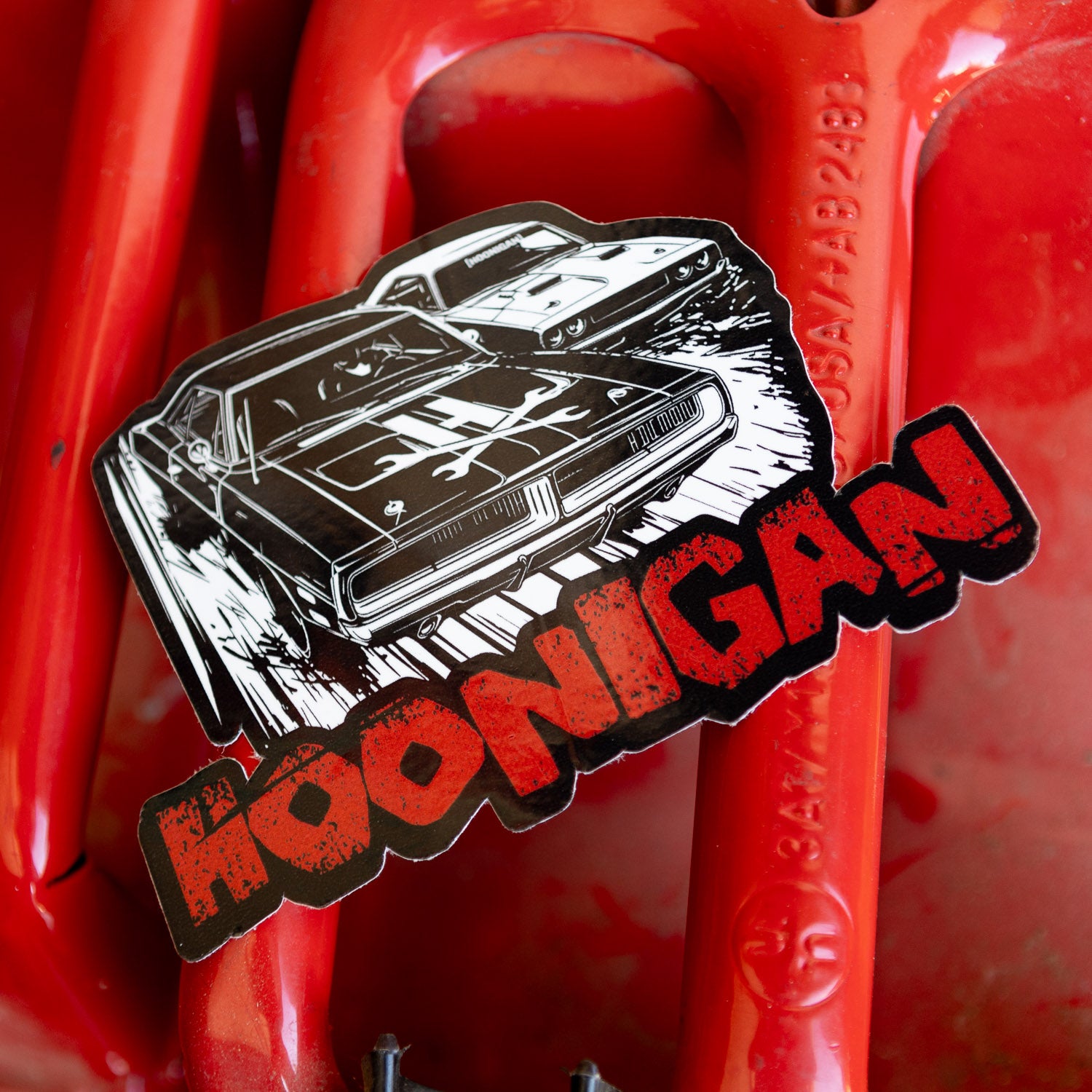 Hoonigan DOUBLE FEATURE sticker featuring classic muscle cars with bold graphics, perfect for automotive enthusiasts.