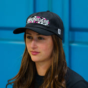 Hoonigan x Lia Block CENSOR BAR unstructured snapback hat displayed on a model against a blue background.
