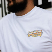 White short sleeve t-shirt featuring a colorful Hoonigan SCUMBUG graphic on the chest, perfect for motorsport enthusiasts.
