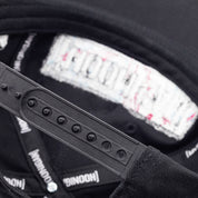 Unstructured black snapback hat featuring Hoonigan branding and adjustable strap for a comfortable fit.