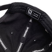 Interior view of the Hoonigan x Lia Block Censor Bar Unstructured Snapback Hat showcasing the label and fabric details.