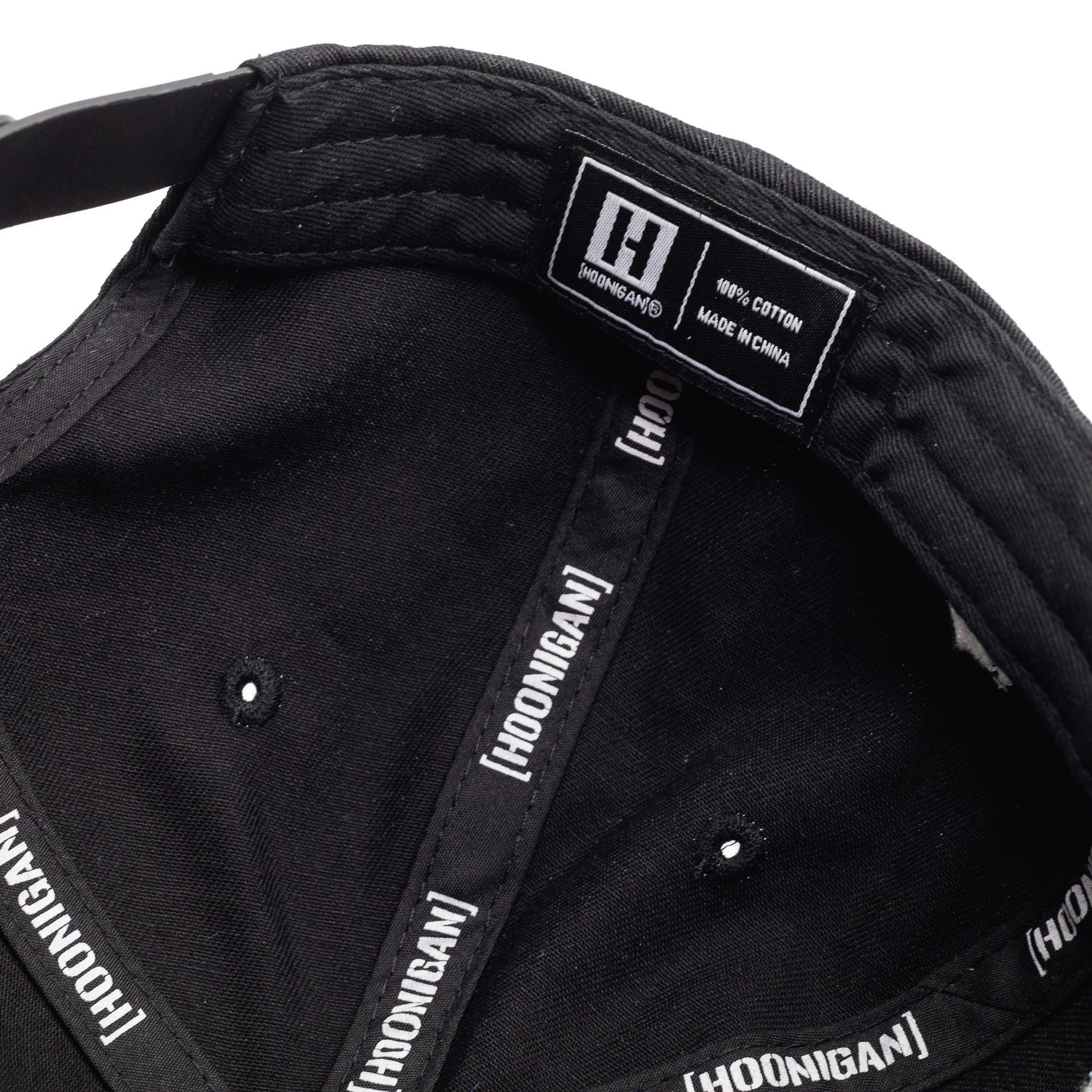Interior view of the Hoonigan x Lia Block Censor Bar Unstructured Snapback Hat showcasing the label and fabric details.
