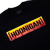 Black short sleeve t-shirt featuring a bold yellow and red Hoonigan logo across the chest, perfect for motorsport enthusiasts.