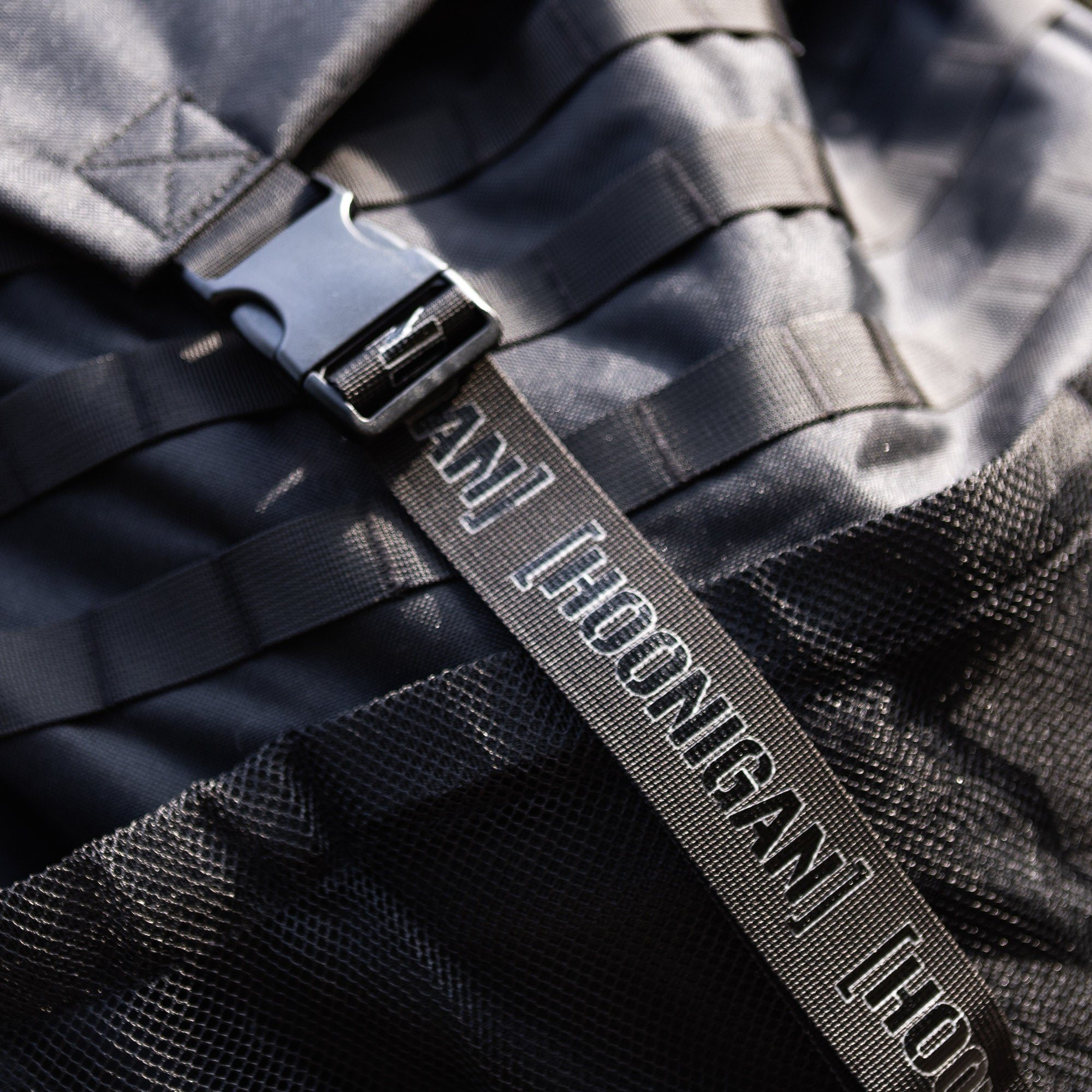 Hoonigan CENSOR BAR backpack featuring durable straps and mesh pockets, ideal for automotive enthusiasts on the go.