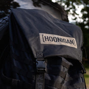 Hoonigan CENSOR BAR spare tire backpack featuring durable fabric and adjustable straps for automotive enthusiasts.